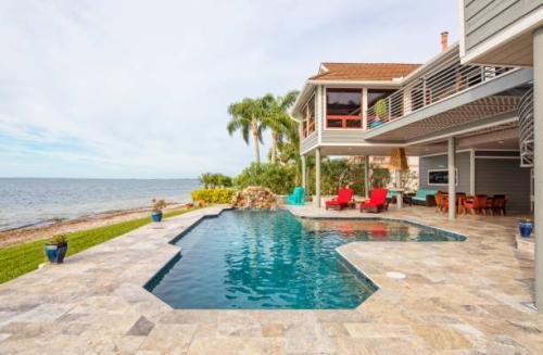 A beautiful swimming pool in a tropical setting.